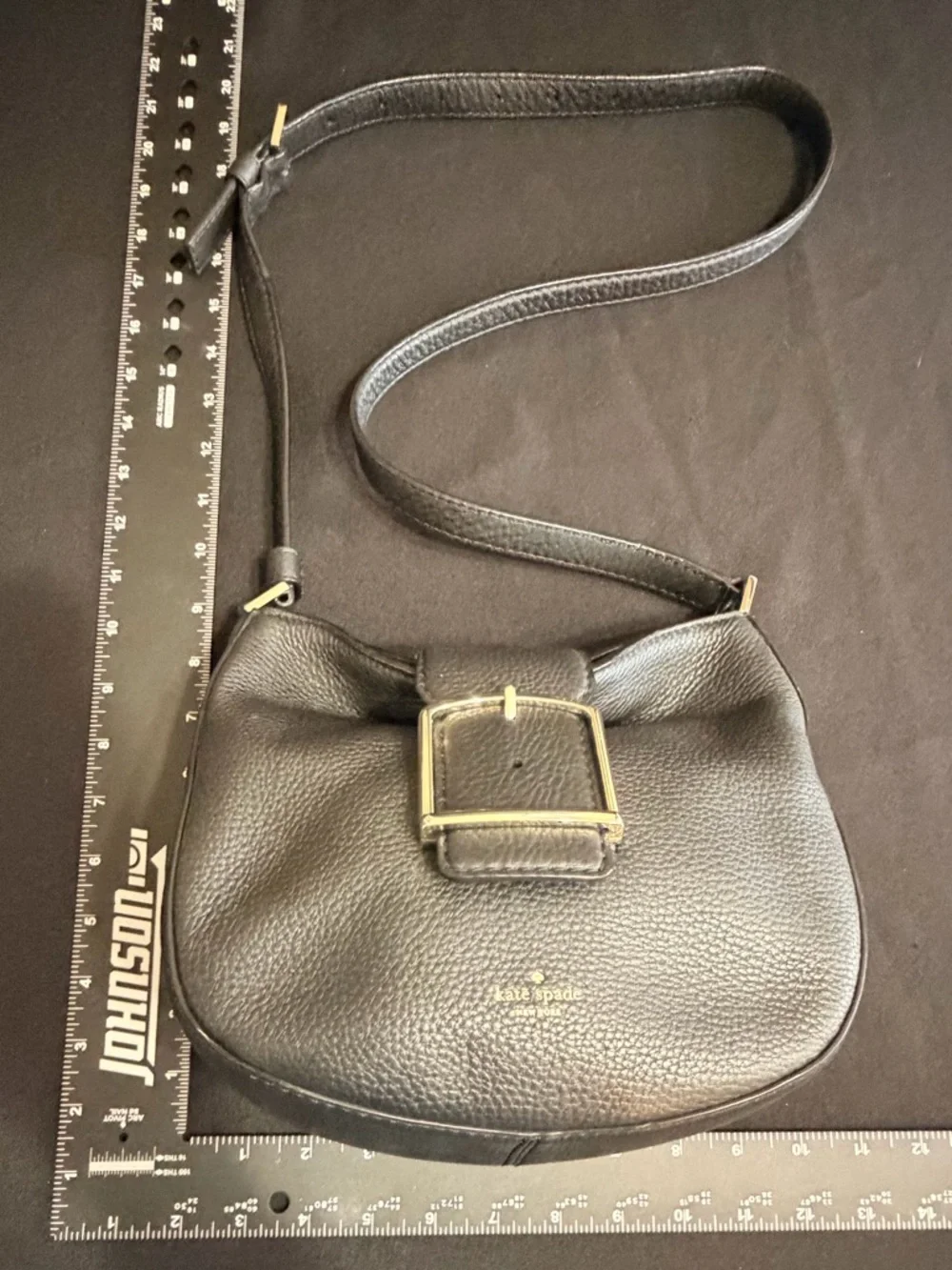 Kate Spade Black Saddle Bag Like New Condition. Very stylish and comfortable.